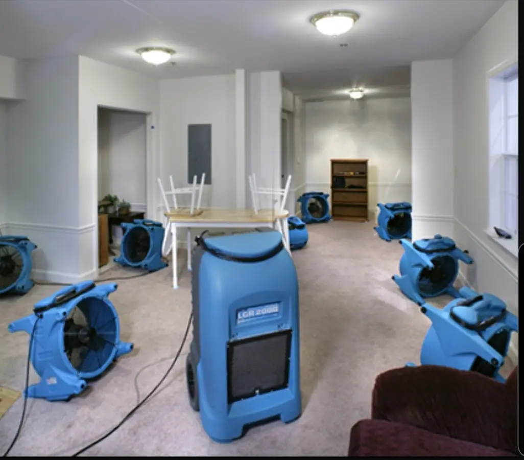 Air movers and dehumidifier setup for Water Damage Restoration in Central